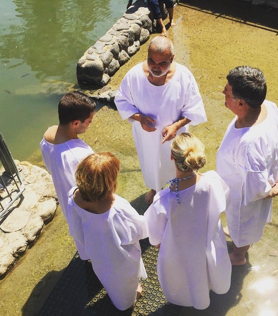 A baptism in the Jordan River, in the Galilee.