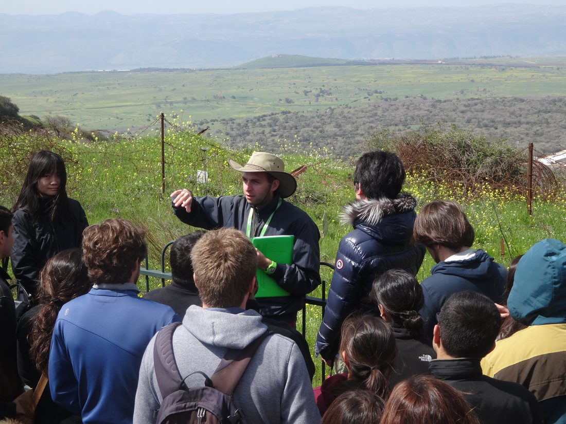 A guide briefing travellers on the strategic landscape of the Golan Heights