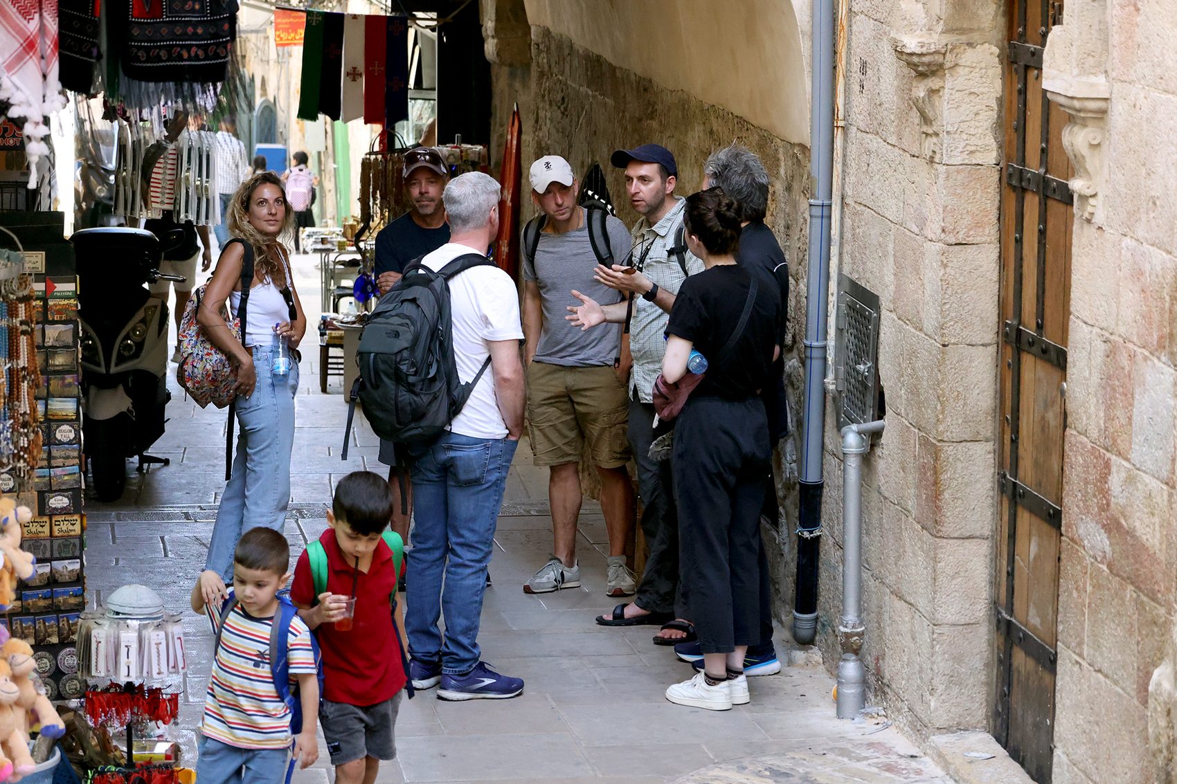 Israeli tour guide Samuel leading a small private group through the Old City of Jerusalem