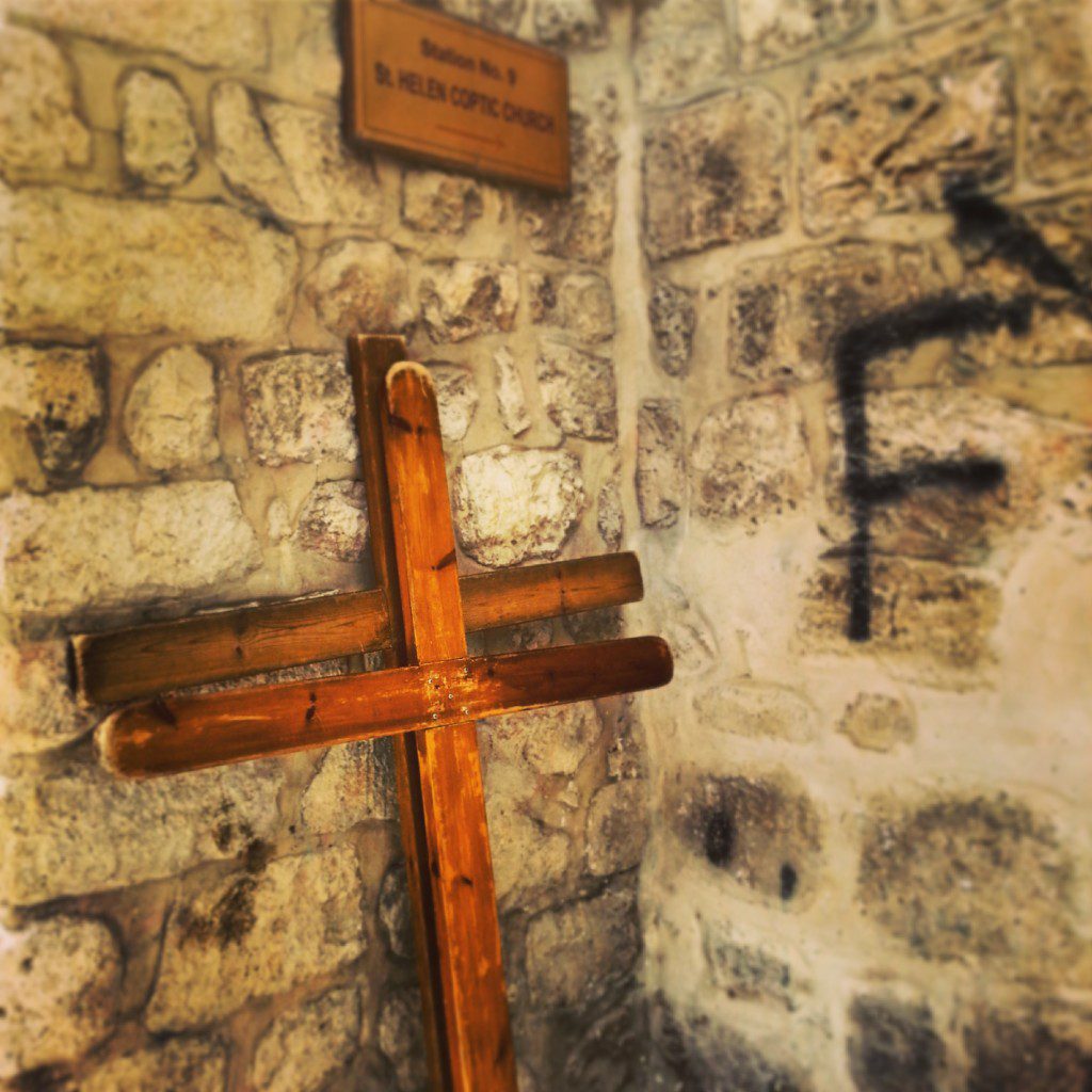 Crosses left by pilgrims at station nine on the Via Dolorosa