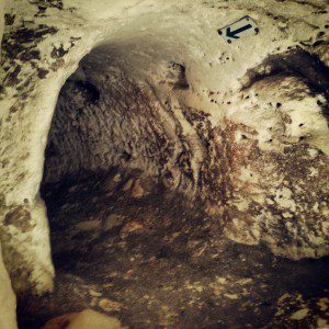 Squeezing through the tunnels used during the Bar Kochba Revolt
