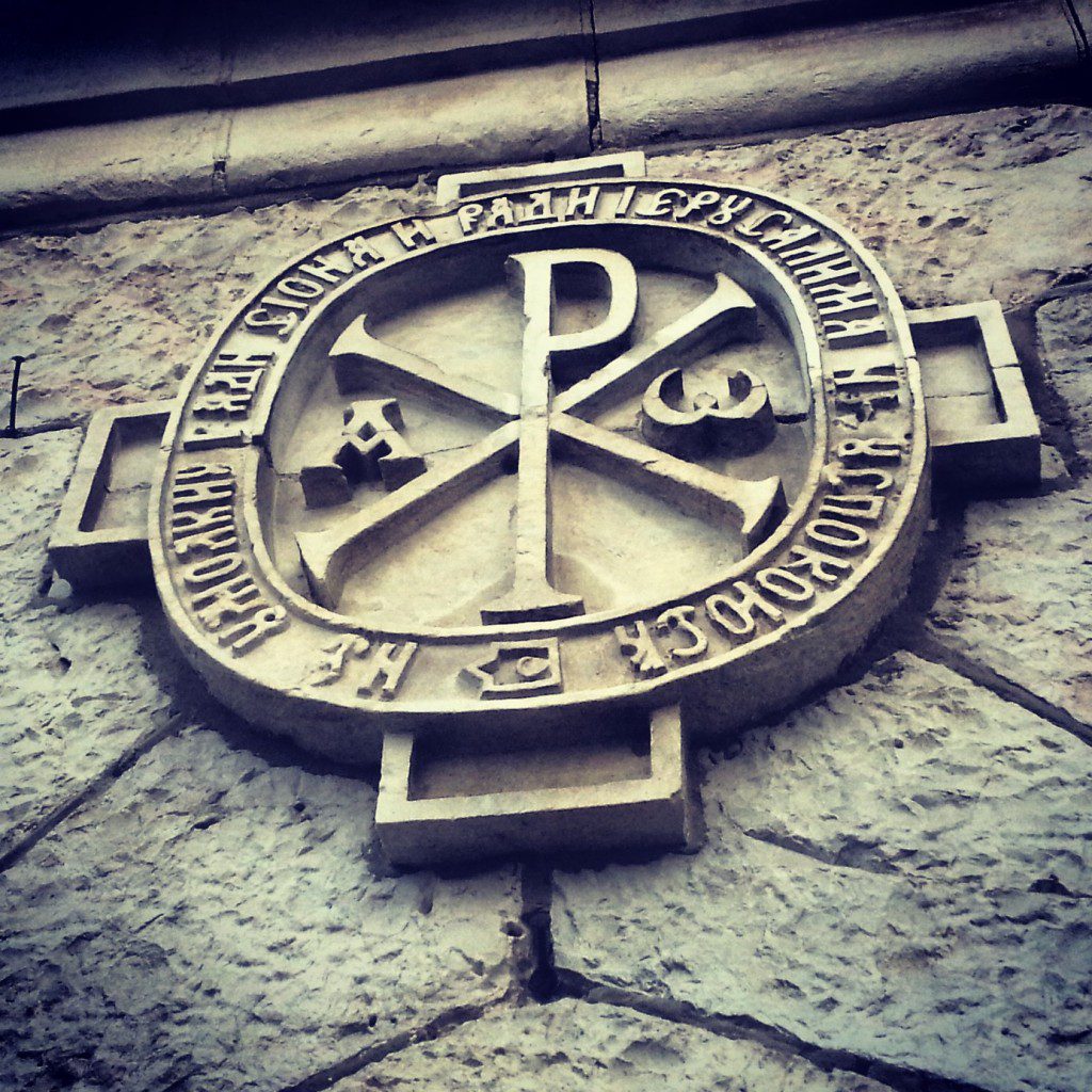 A carved Chi-Rho Christogram emblem on a stone building in Jerusalem