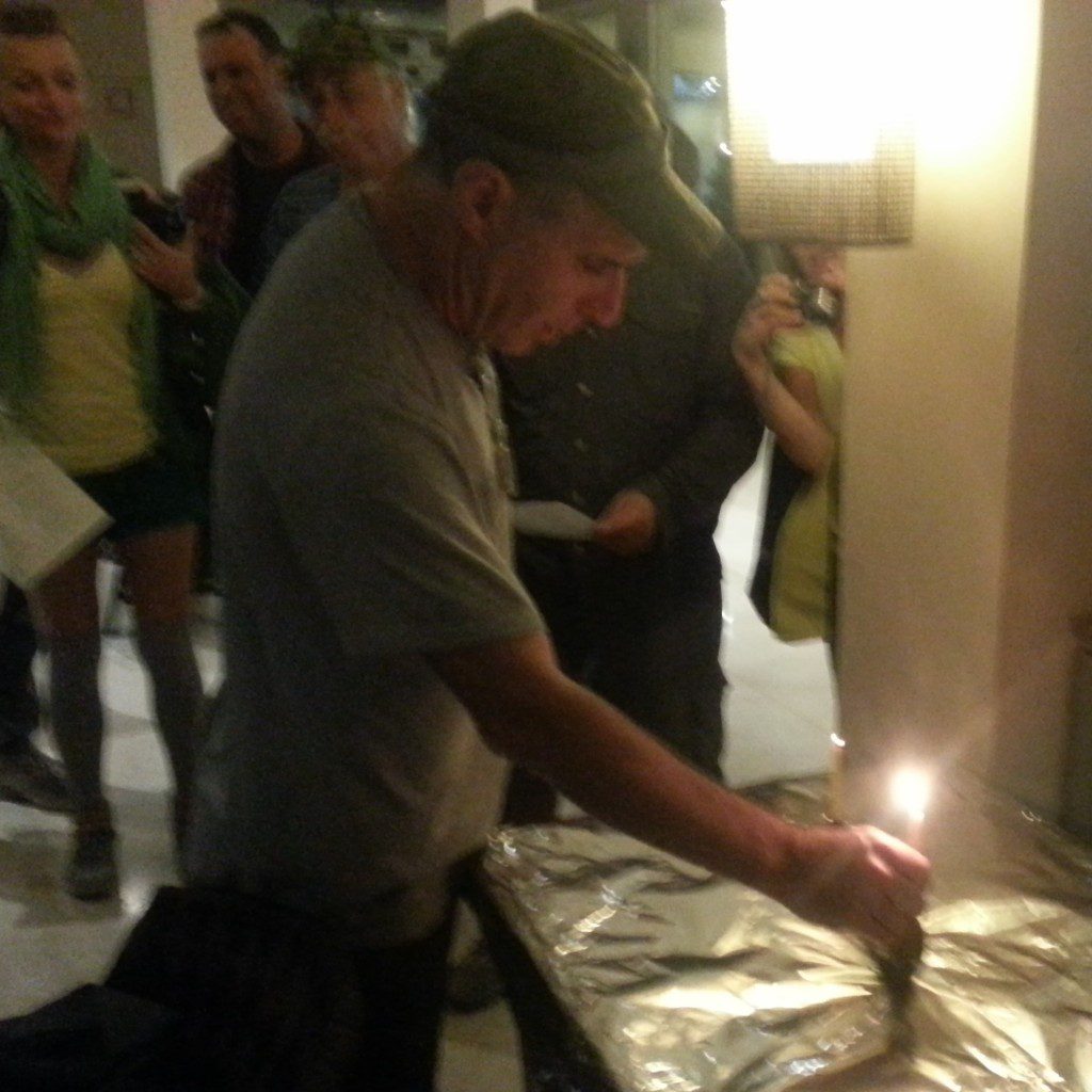 Our infamous course coordinator Benny lights the chanukkiah