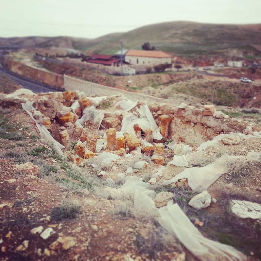 Remains of a Herodian bath house - in the background is Route 1 and the Inn of the Good Samaritan