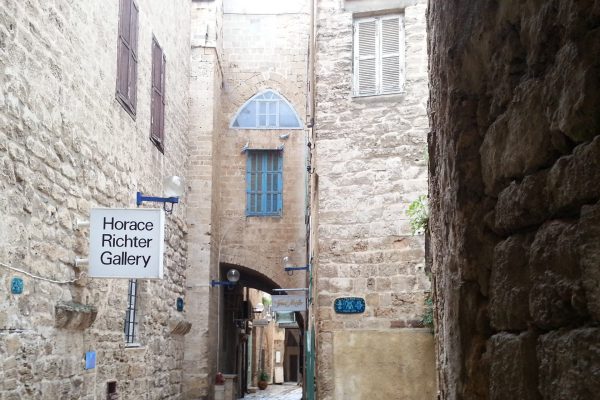 A stone alleyway in Old Jaffa, with the Horace Richter Gallery sign