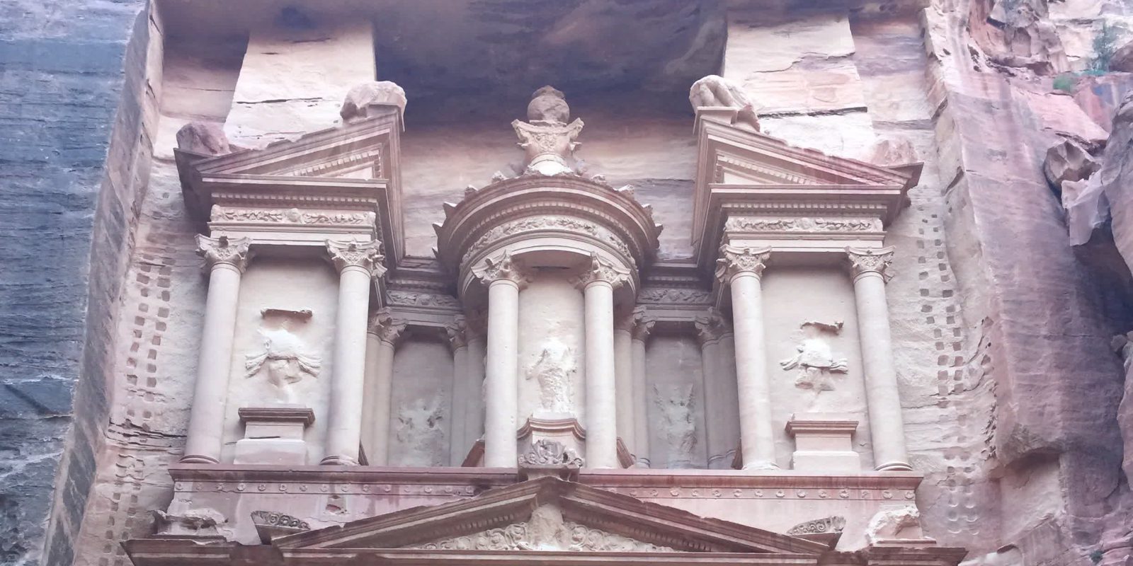 The Treasury (Al-Khazneh) carved into the rose sandstone at Petra, Jordan