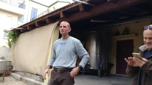 Barak Dahan speaking to a visiting group in the yard outside the Somek winery production building
